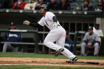 CHICAGO - APRIL 29:  Carlos Quentin #20 of the Chicago White Sox runs to first against the Seattle Mariners during the game on April 29, 2009 at U.S. Cellular Field in Chicago, Illinois. (Photo by Jonathan Daniel/Getty Images) 