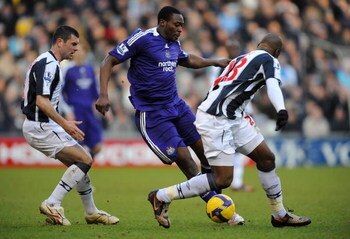 WEST BROMWICH, UNITED KINGDOM - FEBRUARY 07:  Shola Ameobi of Newcastle battles with Paul Robinson and Abdoulaye Meite of West Brom during the Barclays Premier League match between West Bromwich Albion and Newcastle United at The Hawthorns on February 7, 