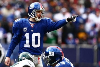 EAST RUTHERFORD, NJ - JANUARY 11:  Eli Manning #10 of the New York Giants gestures against the Philadelphia Eagles during the NFC Divisional Playoff Game on January 11, 2009 at Giants Stadium in East Rutherford, New Jersey.  (Photo by Chris McGrath/Getty 