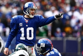 EAST RUTHERFORD, NJ - JANUARY 11:  Eli Manning #10 of the New York Giants gestures against the Philadelphia Eagles during the NFC Divisional Playoff Game on January 11, 2009 at Giants Stadium in East Rutherford, New Jersey.  (Photo by Chris McGrath/Getty 