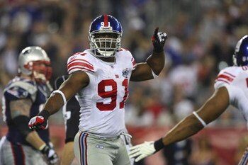 GLENDALE, AZ - FEBRUARY 03:  Defensive end Justin Tuck #91 of the New York Giants reacts after a sack in the second quarter of Super Bowl XLII against the New England Patriots on February 3, 2008 at the University of Phoenix Stadium in Glendale, Arizona. 