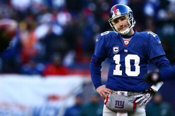 EAST RUTHERFORD, NJ - JANUARY 11:  Eli Manning #10 of the New York Giants looks on against the Philadelphia Eagles during the NFC Divisional Playoff Game on January 11, 2009 at Giants Stadium in East Rutherford, New Jersey.  (Photo by Chris McGrath/Getty 