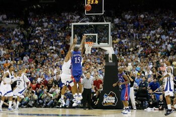 SAN ANTONIO - APRIL 07:  Mario Chalmers #15 of the Kansas Jayhawks shoots and makes a three-pointer to tie the game to send it into overtime against the Memphis Tigers during the 2008 NCAA Men's National Championship game at the Alamodome on April 7, 2008