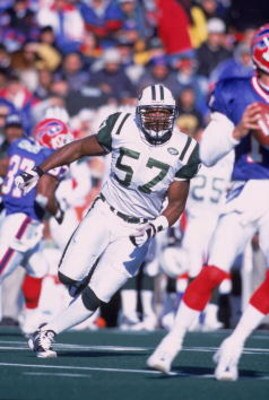 7 Oct 2001:  Mo Lewis #57 of the New York Jets moves in to tackle Rob Johnson #11 of the Buffalo Bills during the game at the Ralph Wilson Stadium in Orchard Park, New York.  The Jets defeated the Bills 42-36.Mandatory Credit: Rick Stewart/Allsport