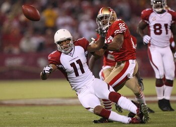 SAN FRANCISCO - SEPTEMBER 10:  Larry Fitzgerald #11 of the Arizona Cardinals can't catch a pass over Nate Clements #22 of the San Francisco 49ers during an NFL game on September 10, 2007 at Monster Park in San Francisco, California.  (Photo by Jed Jacobso