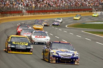CONCORD, NC - MAY 25:  David Reutimann, driver of the #00 Aaron's Dream Machine Toyota, leads a group of cars during the NASCAR Sprint Cup Series Coca-Cola 600 on May 25, 2009 at Lowe's Motor Speedway in Concord, North Carolina.  (Photo by Streeter Lecka/