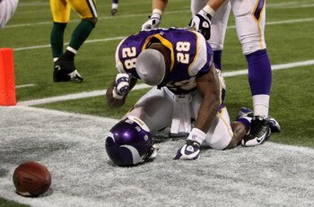 MINNEAPOLIS - NOVEMBER 09:  Running back Adrian Peterson #28 of the Minnesota Vikings celebrates his game winning 29 yard touchdown run with 2:22 left in the game with the Green Bay Packers on November 9, 2008 at the Metrodome in Mineapolis, Minnesota.  (