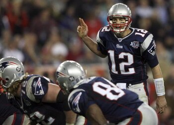 GLENDALE, AZ - FEBRUARY 03:  Tom Brady #12 of of the New England Patriots calls out from under center in the fourth quarter of Super Bowl XLII against the New York Giants on February 3, 2008 at the University of Phoenix Stadium in Glendale, Arizona.  (Pho