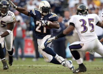 SAN DIEGO - NOVEMBER 25:  Runningback LaDainian Tomlinson #21 of the San Diego Chargers runs against the Baltimore Ravens en route to the Chargers's 32-14 win during their NFL Game at Qualcomm Stadium November 25, 2007 in San Diego, California. Tomlinson 