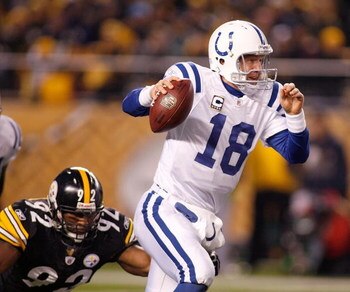 PITTSBURGH - NOVEMBER 09: Peyton Manning #18 of the Indianapolis Colts scrambles away from James Harrison #92 of the Pittsburgh Steelers on November 9, 2008 at Heinz Field in Pittsburgh, Pennsylvania.  (Photo by Rick Stewart/Getty Images)