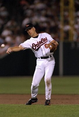 5 Sep 1995:  Shortstop Cal Ripken of the Baltimore Orioles throws the ball in a game against the California Angels at Camden Yards in Baltimore, Maryland during which Ripken tied Lou Gehrig''s record for number of consecutive games played at 2130.  The Or