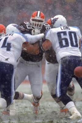 17 Dec 2000:  Keith McKenzie #90 of the Cleveland Browns goes head to head against Bruce Matthews #74 and Kevin Long #60 of the Tennessee Titans during the game at the Cleveland Stadium in Cleveland, Ohio. The Titans defeated the Browns 24-0.Mandatory Cre
