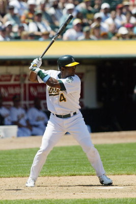 OAKLAND, CA - JUNE 15:  Infielder Miguel Tejada #4 of the Oakland Athletics at bat against the Montreal Expos at the Network Associates Coliseum durung their interleague game on June 15, 2003 in Oakland, California. The Athletics defeated the Expos 9-1. (