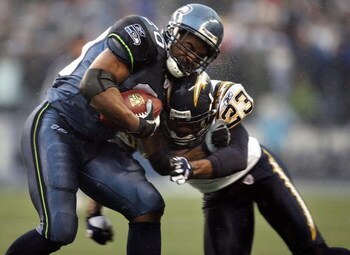 SEATTLE - DECEMBER 24:  Cornerback Quentin Jammer #23 of the San Diego Chargers tackles Maurice Morris #20 of the Seattle Seahawks on December 24, 2006 at Qwest Field in Seattle, Washington.  (Photo by Otto Greule Jr/Getty Images)