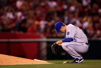ANAHEIM, CA - MAY 9:  Pitcher Zack Greinke #23 of the Kansas City Royals kneels behind the mound before pitching the eighth inning against the Los Angeles Angels of Anaheim on May 9, 2009 at Angel Stadium in Anaheim, California. The Angels won 1-0.  (Phot