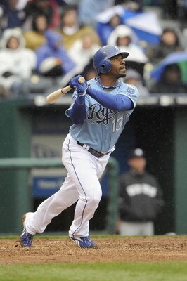 KANSAS CITY, MO - APRIL 12: Alberto Callaspo #13 of the Kansas City Royals makes a hit against the New York Yankees on April 12, 2009 at Kauffman Stadium in Kansas City, Missouri. (Photo by G. Newman Lowrance/Getty Images)