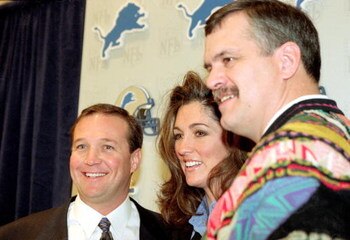 25 Jan 2000:   General Manager Matt Millen poses with the new Head Coach Marty Mornhinneg of the Detroit Lions and his wife Lyndsay Mornhinneg at the Detroit Lions Press Conference in Pontiac, Mighigan.Mandatory Credit: Tom Pidgeon  /Allsport