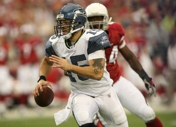 GLENDALE, AZ - DECEMBER 28:  Quarterback Seneca Wallace #15 of the Seattle Seahawks scrambles away from linebacker Gerald Hayes #54 of the Arizona Cardinals on December 28, 2008 at University of Phoenix Stadium in Glendale, Arizona.  (Photo by Stephen Dun