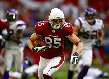 GLENDALE, AZ - DECEMBER 14:  Jerheme Urban #85 of the Arizona Cardinals runs with the ball for yardage during their NFL game against the Minnesota Vikings at the University of Phoenix Stadium on December 14, 2008 in Glendale, Arizona. The Vikings defeated