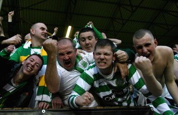 DUNDEE, UNITED KINGDOM - MAY 22:   Celtic fans celebrate after Jan Vennegoor of Hesselink of Celtic scored the first goal during the Clydesdale Bank Premier League match between Dundee United and Celtic at Tannadice Stadium on May 22, 2008 in Dundee, Scot