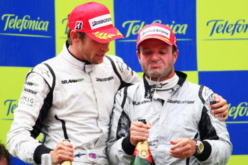 BARCELONA, SPAIN - MAY 10: First placed Jenson Button (L) of Great Britain and Brawn GP and second placed Rubens Barrichello (R) of Brazil and Brawn GP are seen on the podium following the Spanish Formula One Grand Prix at the Circuit de Catalunya on May
