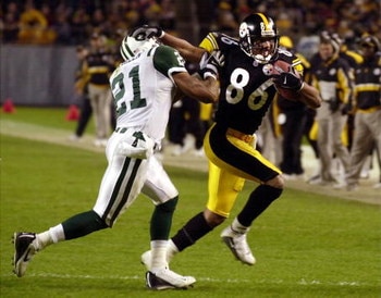 09 Dec 01:  Hines Ward #86 of the Pittsburgh Steelers stiff arms Victor Green #21 of the New York Jets during the third quarter at Heinz Field in Pittsburgh, Pa.  Digital Image. Mandatory Credit: NICK WASS/ALLSPORT