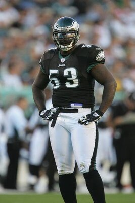 PHILADELPHIA - OCTOBER 31:  Defensive end Hugh Douglas #53 of the Philadelphia Eagles stands on the field during the game against the Baltimore Ravens at Lincoln Financial Field on October 31, 2004 in Philadelphia, Pennsylvania. The Eagles defeated the Ra