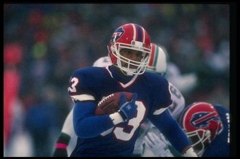 12 Jan 1991:  Wide receiver Andre Reed of the Buffalo Bills runs with the ball during a playoff game against the Miami Dolphins at Rich Stadium in Orchard Park, New York.  The Bills won the game, 44-34. Mandatory Credit: Rick Stewart  /Allsport