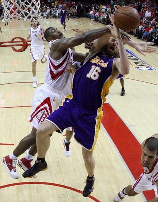 HOUSTON - MAY 08:  Guard Ron Artest #96 of the Houston Rockets commits a flagrant foul on Pau Gasol #16 of the Los Angeles Lakers in Game Three of the Western Conference Semifinals during the 2009 NBA Playoffs at Toyota Center on May 8, 2009 in Houston, T