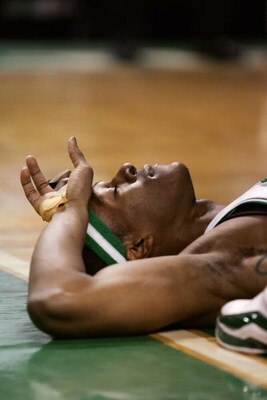 BOSTON - MAY 4:  Rajon Rondo #9 of the Boston Celtics  lays on the floor after he was flagrantly fouled by Marvin Williams of the Atlanta Hawks in Game Seven of the Eastern Conference Quarterfinals during the 2008 NBA Playoffs at the TD Banknorth Garden o