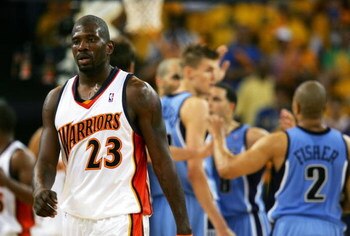 OAKLAND, CA - MAY 13:  Jason Richardson #23 of the Golden State Warriors walks away from members of the Utah Jazz celebrating a point in Game 4 of the Western Conference Semifinals during the 2007 NBA Playoffs on May 13, 2007 at Oracle Arena in Oakland, C