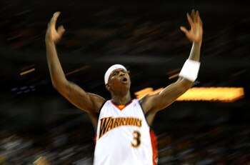 OAKLAND, CA - NOVEMBER 06:  Al Harrington #3 of the Golden State Warriors celebrates against the Cleveland Cavaliers during an NBA game on November 6, 2007 at Oracle Arena in Oakland, California. NOTE TO USER: User expressly acknowledges and agrees that, 