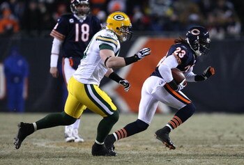 CHICAGO - DECEMBER 22: Devin Hester #23 of the Chicago Bears is chased by A.J. Hawk #50 of the Green Bay Packers on December 22, 2008 at Soldier Field in Chicago, Illinois. The Bears defeated the Packers 20-17 in overtime. (Photo by Jonathan Daniel/Getty 