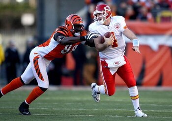 CINCINNATI - DECEMBER 28: Tyler Thigpen #4 of the Kansas City Chiefs runs with the ball while defended by Antwan Odom #98 of the Cincinnati Bengals during the NFL game on December 28, 2008 at Paul Brown Stadium in Cincinnati, Ohio. (Photo by Andy Lyons/Ge