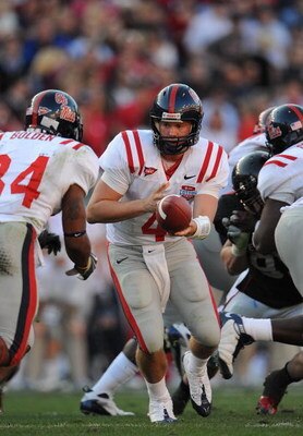 DALLAS - JANUARY 02:  Quarterback Jevan Snead #4 of the Mississippi Rebels drops back to pass against the Texas Tech Red Raiders during the AT&T Cotton Bowl on January 2, 2009 at the Cotton Bowl in Dallas, Texas.  (Photo by Ronald Martinez/Getty Images)