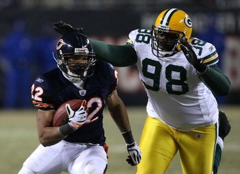 CHICAGO - DECEMBER 22: Matt Forte #22 of the Chicago Bears runs past Alfred Malone #98 of the Green Bay Packers on December 22, 2008 at Soldier Field in Chicago, Illinois. The Bears defeated the Packers 20-17 in overtime. (Photo by Jonathan Daniel/Getty I