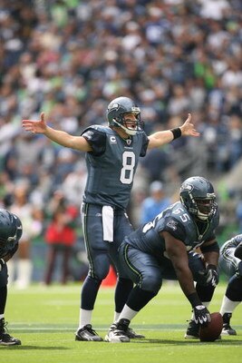 SEATTLE - SEPTEMBER 21:  Matt Hasselbeck #8 of the Seattle Seahawks gestures under center Chris Spencer #65 during the game against the St. Louis Rams on September 21, 2008 at Qwest Field in Seattle, Washington. (Photo by Otto Greule Jr/Getty Images) 