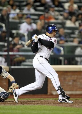 NEW YORK - APRIL 15:  Carlos Beltran of the New York Mets singles to score Daniel Murphy in the fourth inning to give the Mets a 1-0 lead over the San Diego Padres on April 15, 2009 at Citi Field in the Flushing neighborhood of the Queens borough of New Y