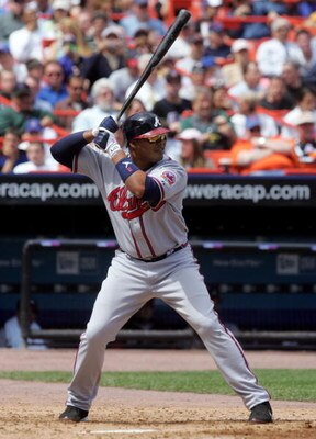 NEW YORK - APRIL 19:  Andruw Jones #25 of the Atlanta Braves bats against the New York Mets on April 19, 2006 at Shea Stadium in the Flushing neighborhood of the Queens borough of New York City. The Braves defeated the Mets 2-1.  (Photo by Jim McIsaac/Get