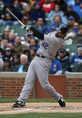 CHICAGO - APRIL 15: Todd Helton of the Colorado Rockies, wearing a #42 jersey on Jackie Robinson Day, swings the bat against the Chicago Cubs on April 15, 2009 at Wrigley Field in Chicago, Illinois. The Rockies defeated the Cubs 5-2. (Photo by Jonathan Da