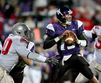EVANSTON, IL - NOVEMBER 11:  Vernon Gholston #50 of the Ohio State Buckeyes closes in on a sack against Mike Kafka #13 of the Northwestern Wildcats on November 11, 2006 at Ryan Field in Evanston, Illinois. Ohio State defeated Northwestern 54-10.  (Photo b