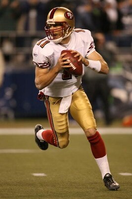 SEATTLE - NOVEMBER 12:  Alex Smith #11 of the San Francisco 49ers carries the ball during the NFL game against the Seattle Seahawks at Qwest Field on November 12, 2007 in Seattle, Washington. (Photo by Otto Greule Jr/Getty Images)