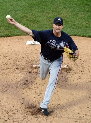 NEW YORK - MAY 11:  Derek Lowe #32 of the Atlanta Braves throws a pitch against the New York Mets on May 11, 2009 at Citi Field in the Flushing neighborhood of the Queens borough of New York City. The Braves defeated the Mets 8-3. (Photo by Jim McIsaac/Ge