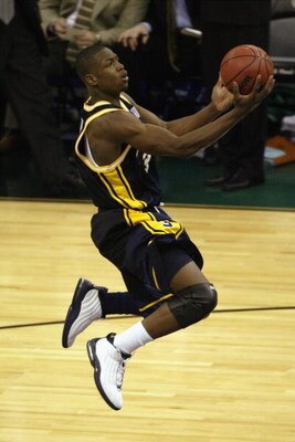 NEW ORLEANS - APRIL 5:  Dwyane Wade #3 of Marquette University Golden Eagles drives to the basket during the semifinal round of the NCAA Final Four Tournament against the University of Kansas Jayhawks at the Louisiana Superdome on April 5, 2003 in New Orl