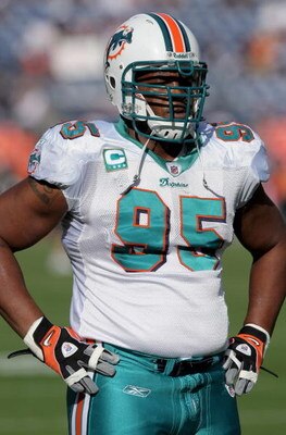 DENVER - NOVEMBER 02:  Defensive tackle Jason Ferguson #95 of the Miami Dolphins warms up prior to facing the Denver Broncos during NFL action at Invesco Field at Mile High on November 2, 2008 in Denver, Colorado. The Dolphins defeated the Broncos 26-17. 