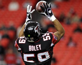 ATLANTA - DECEMBER 14: Linebacker Michael Boley #59 of the Atlanta Falcons grabs a warm-up pass before play against the Tampa Bay Buccaneers  at the Georgia Dome on December 14, 2008 in Atlanta, Georgia.  (Photo by Al Messerschmidt/Getty Images) 