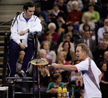 BELFAST, UNITED KINGDOM - FEBRUARY 22:  John McEnroe of the United States complains to the umpire during the second day of the BlackRock Tour of Champions at the Odyssey Arena February 22, 2008 in Belfast, Northern Ireland.  (Photo by Matthew Lewis/Getty 
