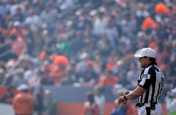 DENVER - SEPTEMBER 14:  Referee Ed Hochuli oversees the action between the San Diego Chargers and the Denver Broncos during NFL action at Invesco Field at Mile High on September 14, 2008 in Denver, Colorado. The Broncos defeated the Chargers 39-38.  (Phot