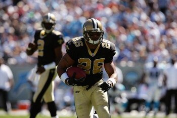 CHARLOTTE, NC - SEPTEMBER 11:  Running back Deuce McAllister #26 of the New Orleans Saints rushes for yards during a game against the Carolina Panthers at Bank of America Stadium on September 11, 2005 in Charlotte, North Carolina.  The Saints defeated the