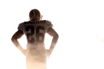 NEW ORLEANS - SEPTEMBER 28:  Deuce McAllister #26 of the New Orleans Saints waits to be introduced before playing the San Francisco 49ers on September 28, 2008 at the Superdome in New Orleans, Louisiana.  (Photo by Chris Graythen/Getty Images)